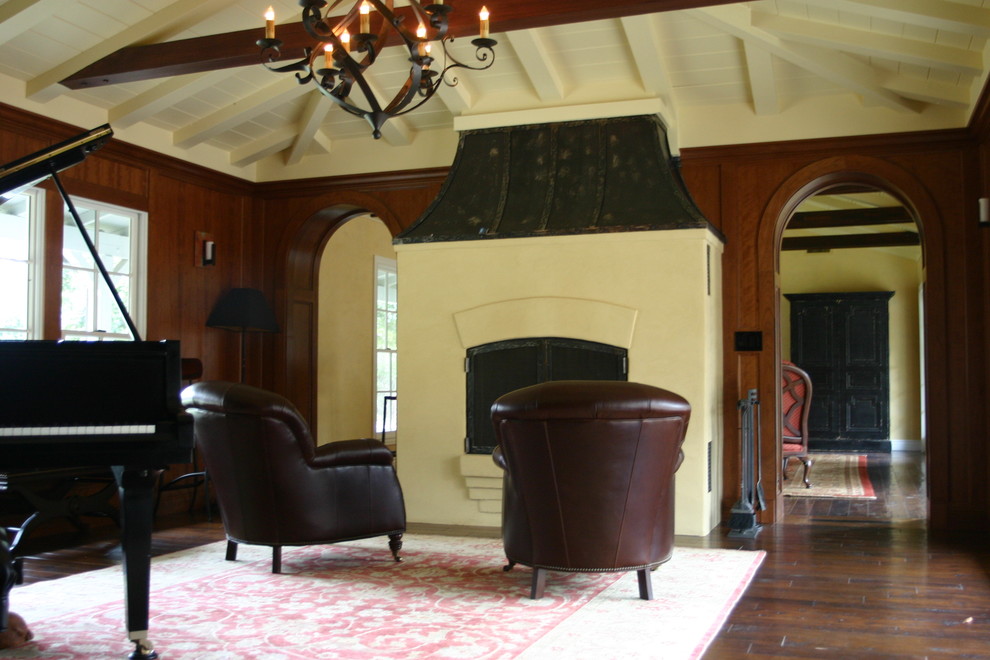 Traditional enclosed home theatre in San Francisco with brown walls and dark hardwood floors.
