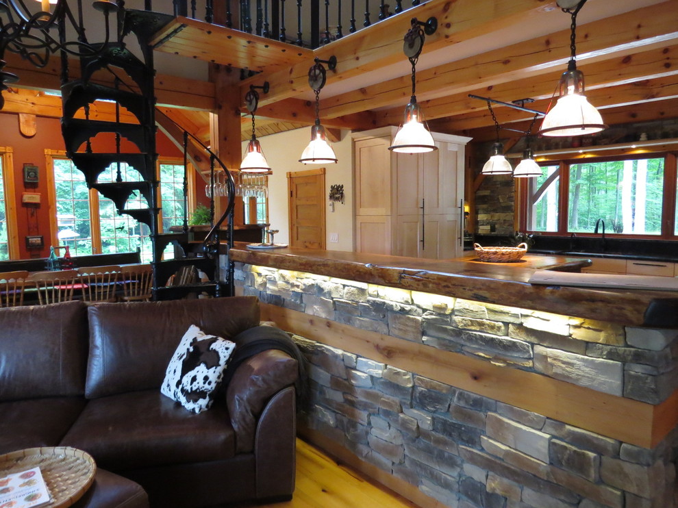 Large mountain style u-shaped light wood floor eat-in kitchen photo in Toronto with shaker cabinets, granite countertops, stone tile backsplash, an island, an undermount sink, light wood cabinets, gray backsplash and stainless steel appliances