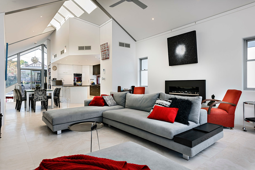 This is an example of a contemporary open concept living room in Perth with white walls and a ribbon fireplace.