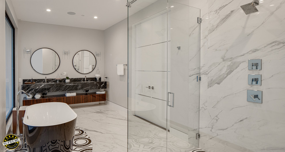 Design ideas for a large modern master bathroom in Los Angeles with flat-panel cabinets, dark wood cabinets, a freestanding tub, an alcove shower, a one-piece toilet, white walls, marble floors, an undermount sink, marble benchtops, white floor, a hinged shower door, black benchtops, a double vanity and a floating vanity.