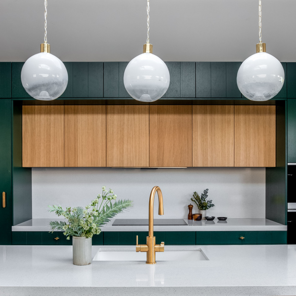 Inspiration for a contemporary eat-in kitchen in London with a single-bowl sink, louvered cabinets, green cabinets, soapstone benchtops, grey splashback, engineered quartz splashback, coloured appliances, terrazzo floors, with island, multi-coloured floor, grey benchtop and vaulted.