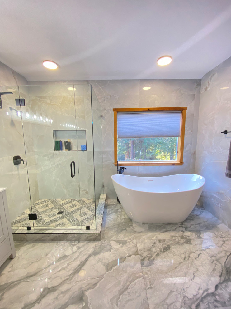 Photo of a large midcentury master bathroom in Portland with shaker cabinets, grey cabinets, a freestanding tub, an open shower, gray tile, ceramic tile, grey walls, ceramic floors, an undermount sink, engineered quartz benchtops, grey floor, a hinged shower door, white benchtops, a double vanity and a freestanding vanity.