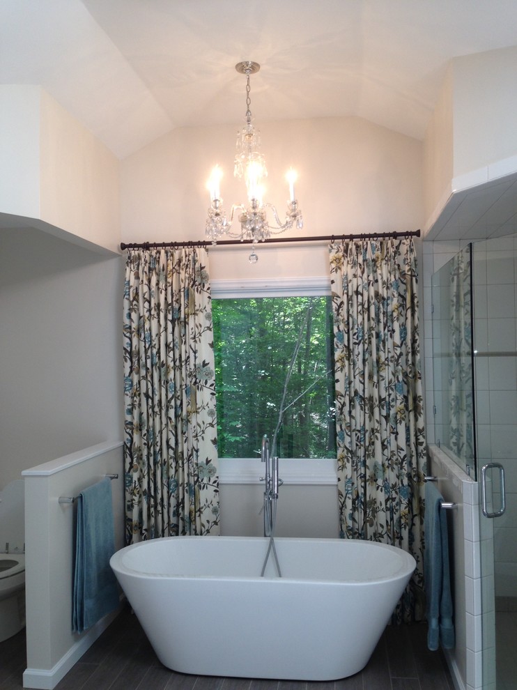 Inspiration for a large traditional master bathroom in Orlando with an undermount sink, white cabinets, quartzite benchtops, a freestanding tub, a corner shower, a two-piece toilet, white tile, ceramic tile, beige walls and porcelain floors.