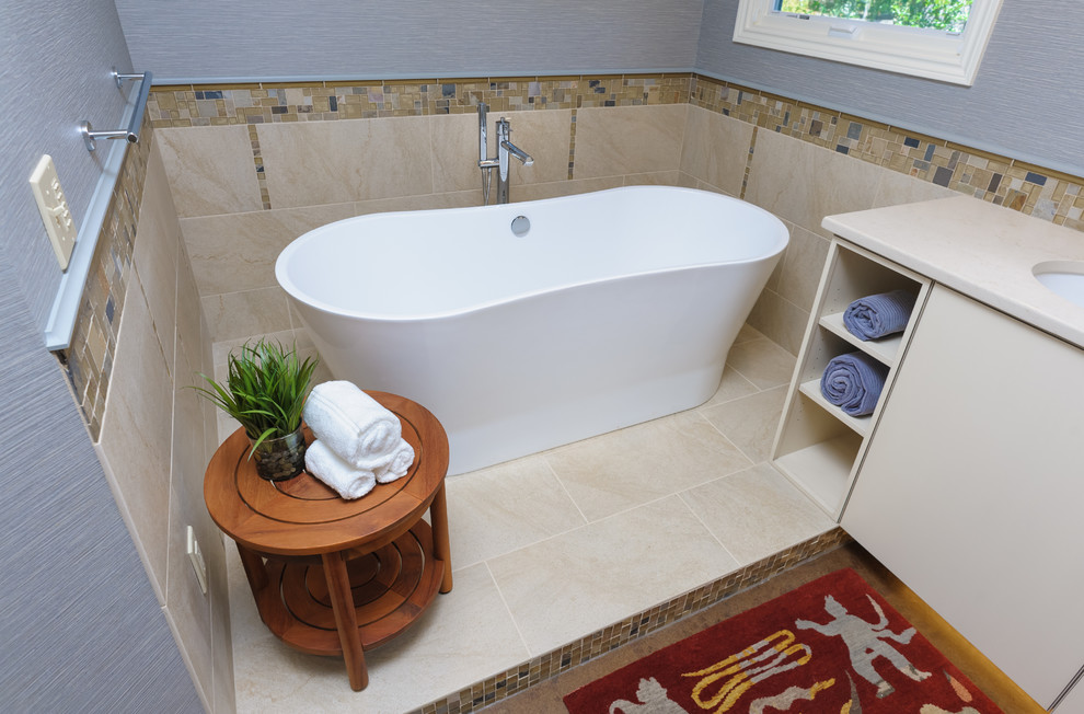 Inspiration for a mid-sized transitional master bathroom in Portland with flat-panel cabinets, white cabinets, a freestanding tub, beige tile, glass tile, blue walls, cork floors, an undermount sink and engineered quartz benchtops.