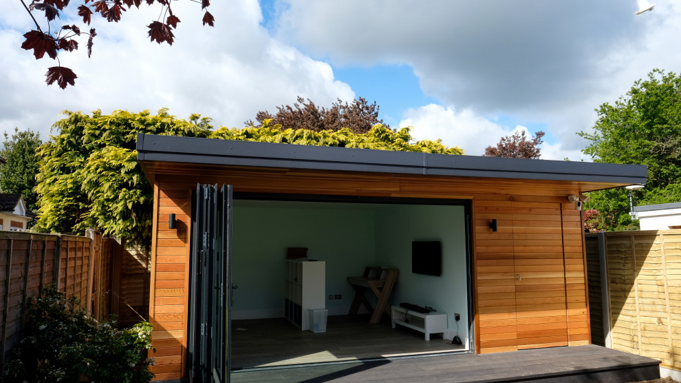 This is an example of a medium sized contemporary detached office/studio/workshop in Surrey.