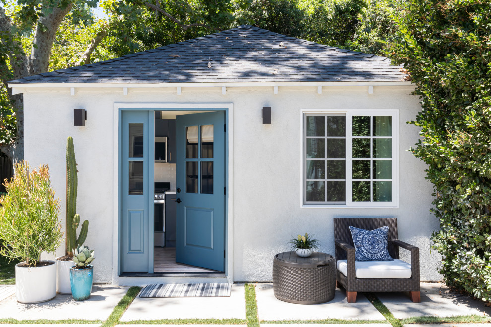 Inspiration for a small transitional white one-story stucco tiny house remodel in Los Angeles with a hip roof, a shingle roof and a black roof