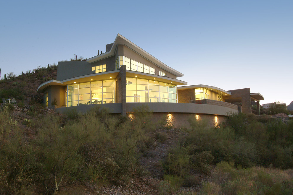 Design ideas for a contemporary two-storey exterior in Phoenix.