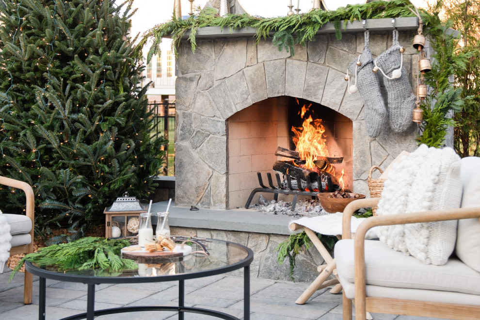 Inspiration for a timeless backyard concrete paver patio remodel in Richmond with a fireplace
