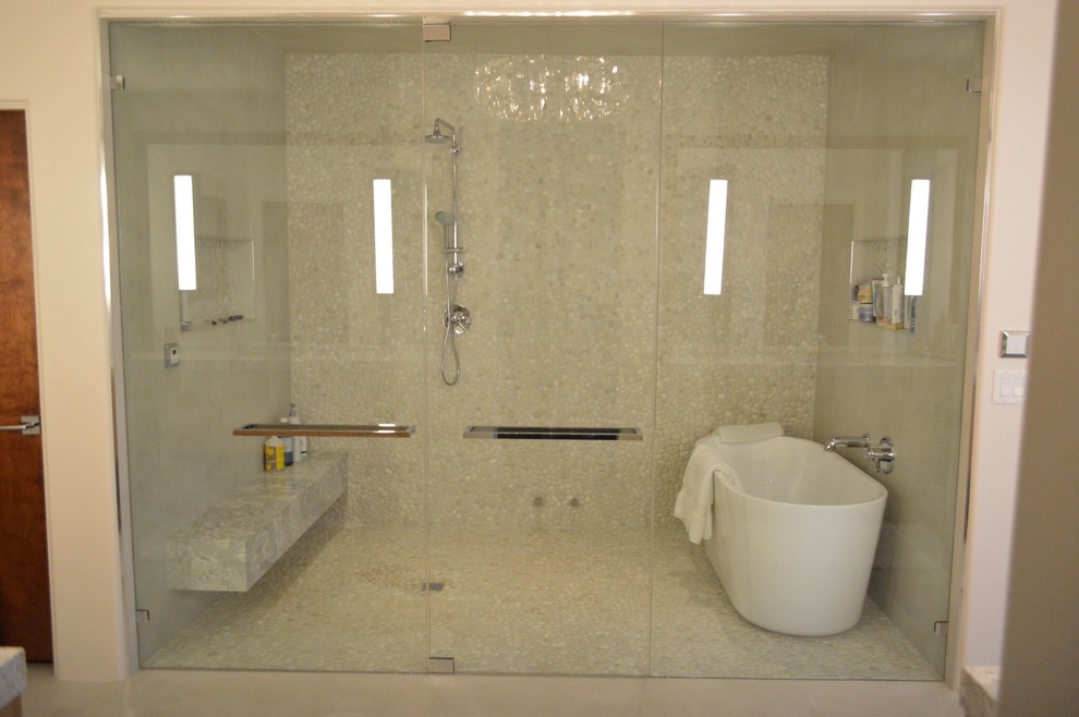 Design ideas for a large contemporary master bathroom in Phoenix with a freestanding tub, an alcove shower, beige floor and a hinged shower door.