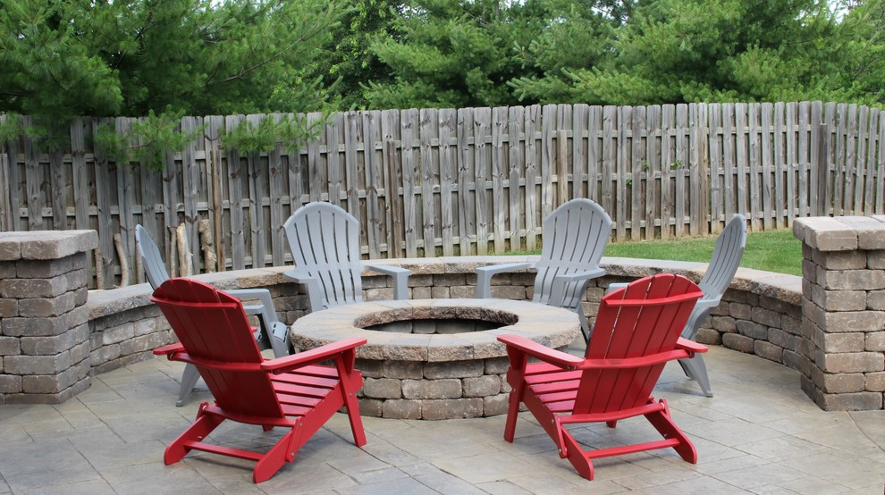 Inspiration for a mid-sized contemporary backyard patio in Kansas City with stamped concrete and no cover.