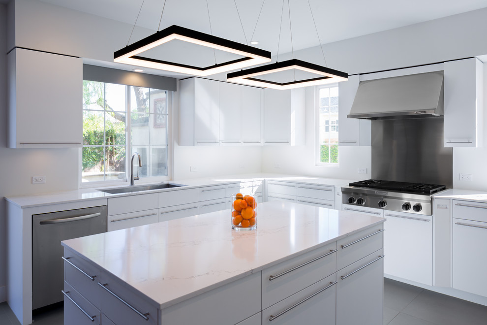 Design ideas for a mid-sized contemporary u-shaped eat-in kitchen in Orange County with an undermount sink, flat-panel cabinets, light wood cabinets, quartz benchtops, white splashback, stone slab splashback, stainless steel appliances, ceramic floors and with island.