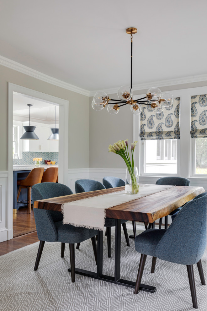 Inspiration for a mid-sized transitional separate dining room in Boston with beige walls, medium hardwood floors, no fireplace and decorative wall panelling.