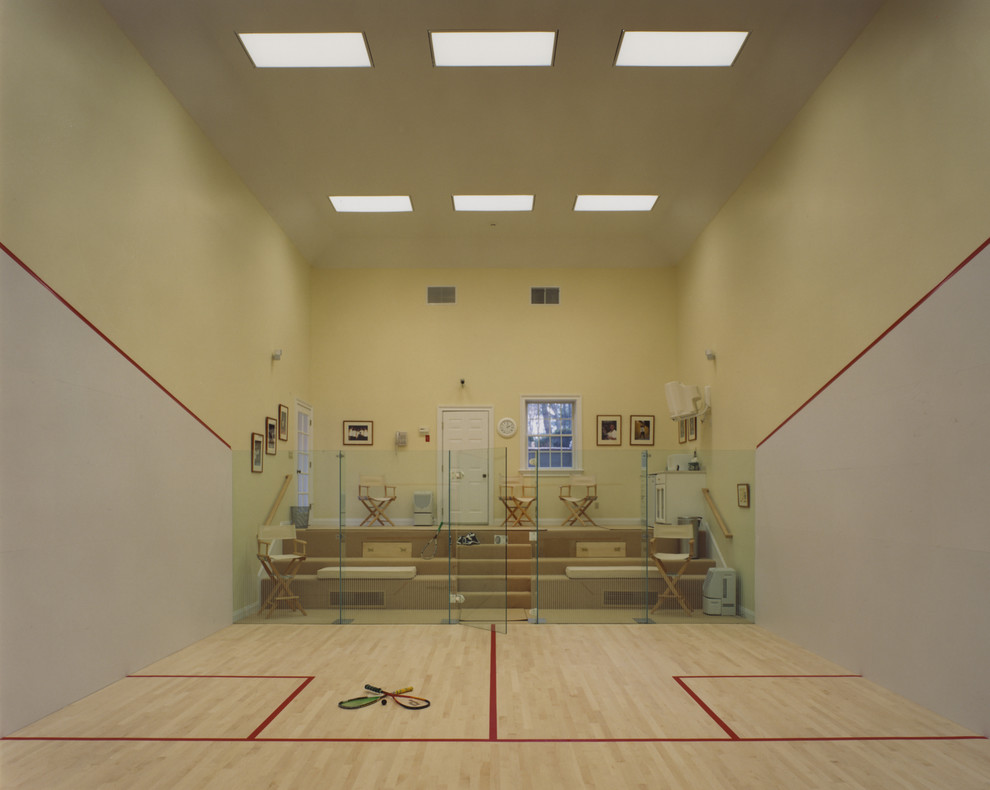 Inspiration for a mid-sized contemporary indoor sport court in New York with yellow walls and light hardwood floors.