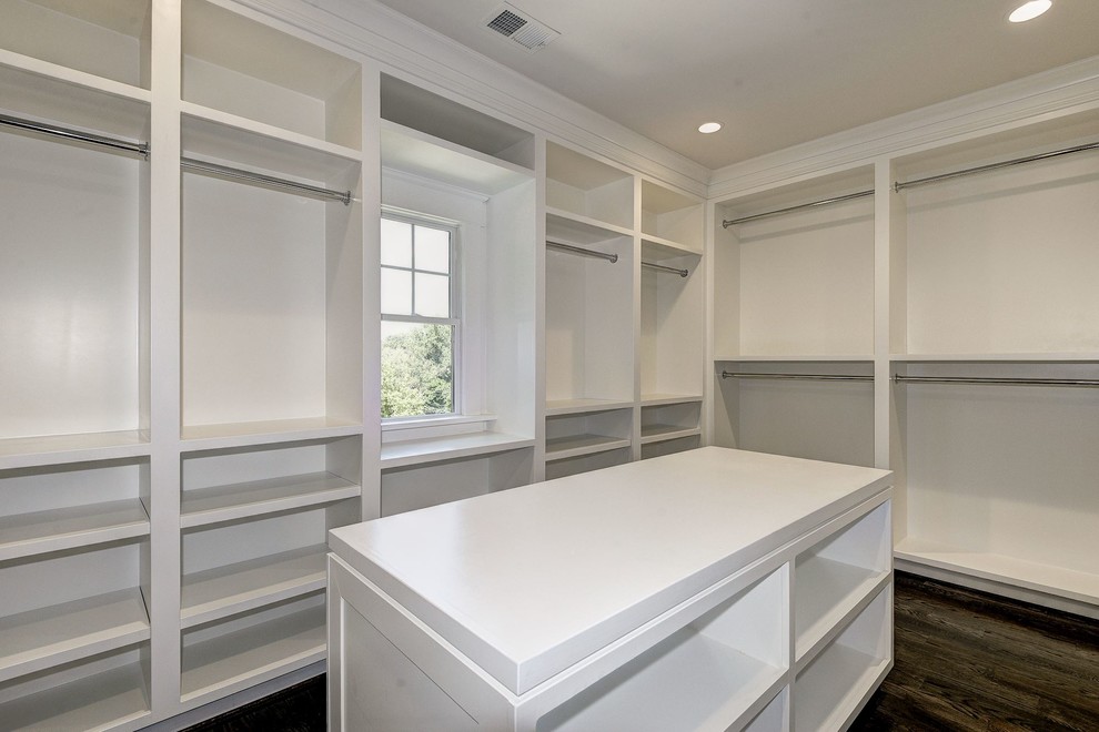 Design ideas for an expansive contemporary gender-neutral walk-in wardrobe in DC Metro with open cabinets, white cabinets, dark hardwood floors and brown floor.
