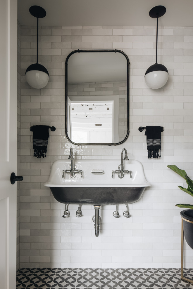 This is an example of a large eclectic family bathroom in Grand Rapids with black cabinets, white tiles, ceramic tiles, white walls, mosaic tile flooring, a console sink, white floors, an open shower and double sinks.