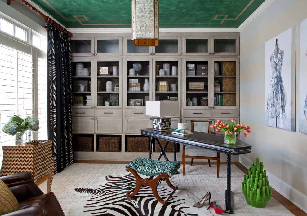 Mid-sized transitional freestanding desk medium tone wood floor home office photo in Atlanta with multicolored walls