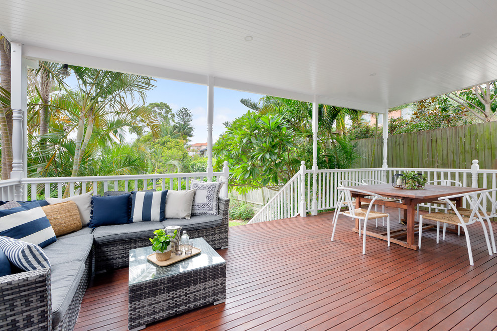 Design ideas for a transitional deck in Sydney with a roof extension.