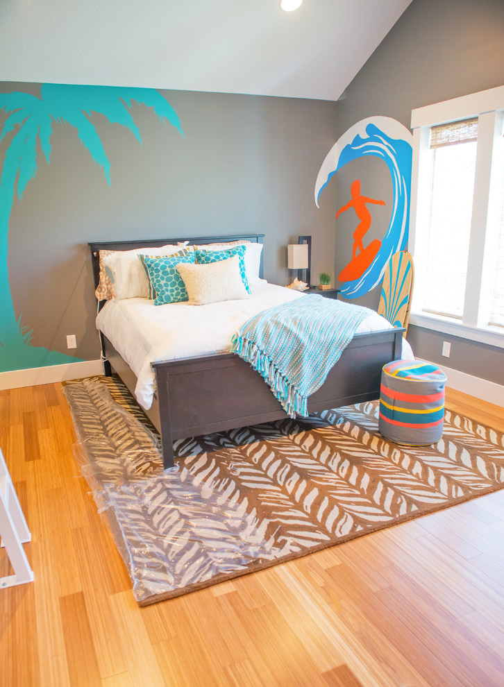 This is an example of a mid-sized beach style gender-neutral kids' room in Salt Lake City with light hardwood floors and grey walls.