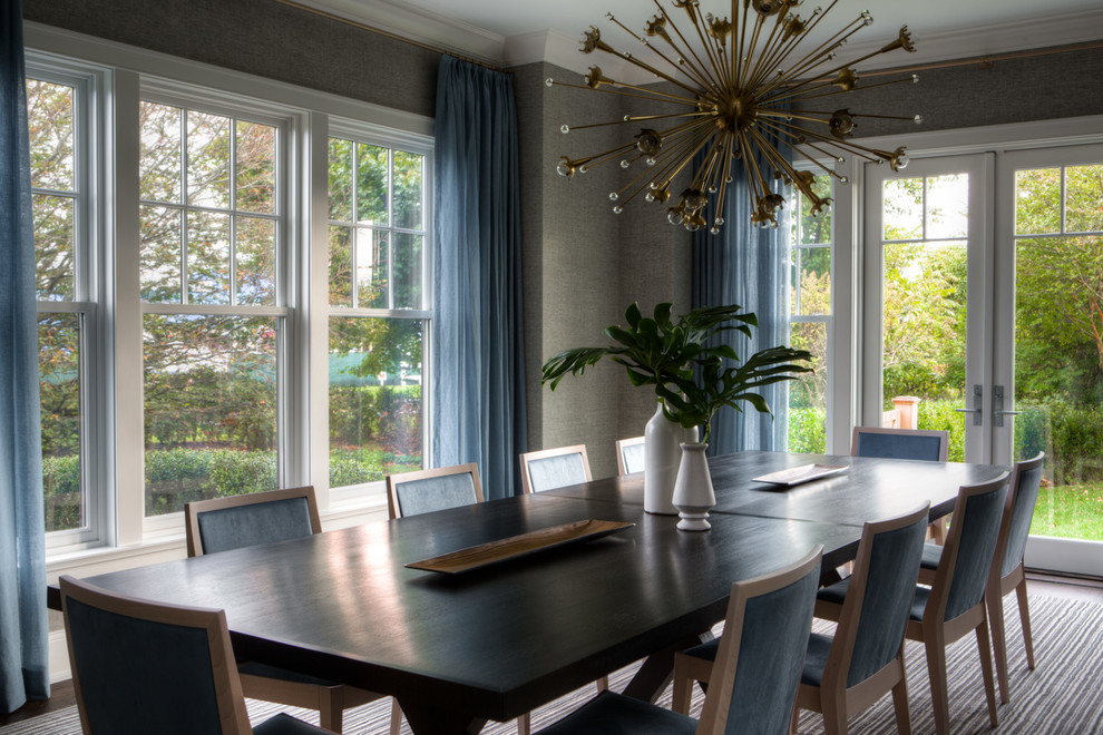 This is an example of a beach style dining room in New York with grey walls, dark hardwood floors and no fireplace.