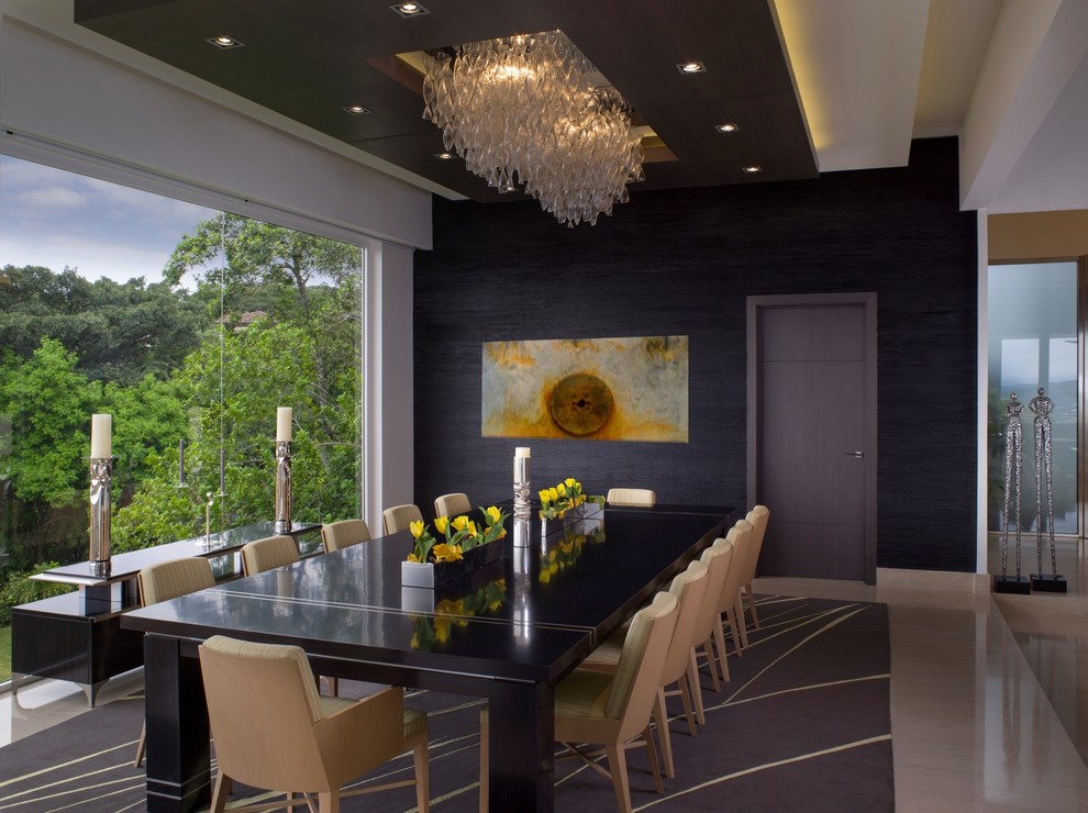 Inspiration for an expansive contemporary kitchen/dining combo in Miami with black walls, porcelain floors and no fireplace.