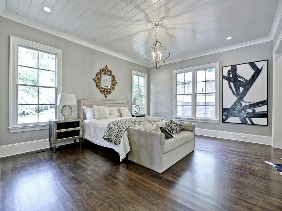 Inspiration for a master bedroom in Atlanta with grey walls and medium hardwood floors.