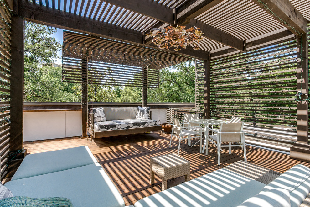 Design ideas for an eclectic rooftop deck in Dallas with a pergola.