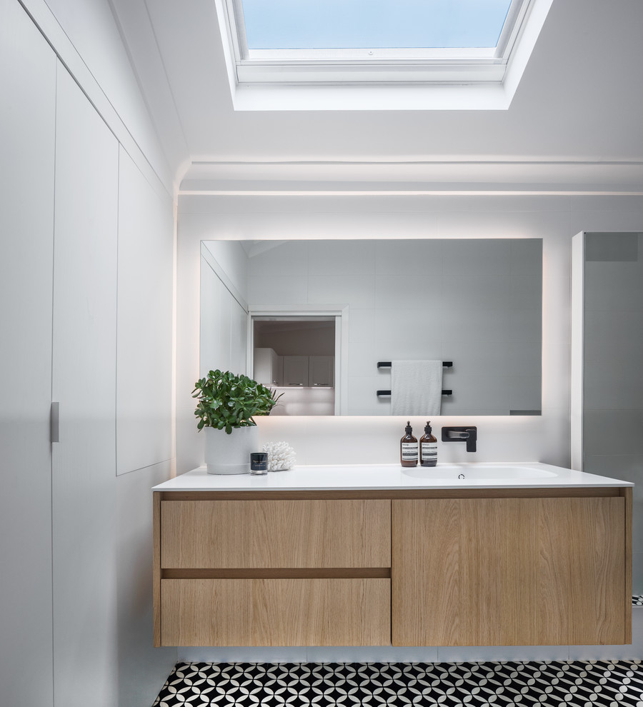 Large modern bathroom in Perth with light wood cabinets, an open shower, white walls, an integrated sink, engineered quartz benchtops and an open shower.