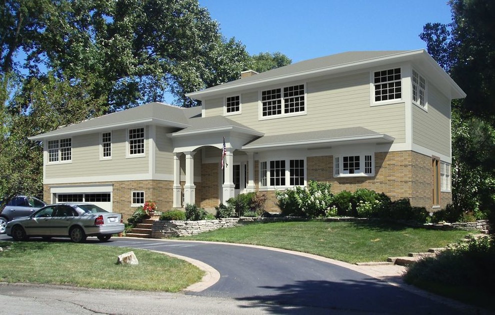 Example of a small transitional green split-level mixed siding exterior home design in Chicago