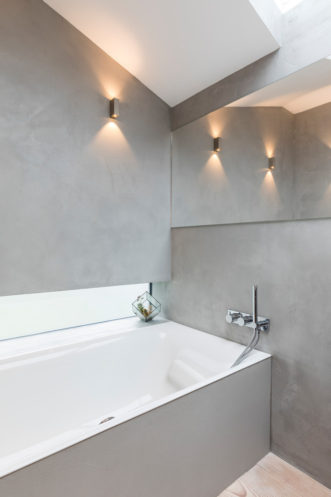 Inspiration for a mid-sized modern 3/4 bathroom in London with open cabinets, grey cabinets, an open shower, a one-piece toilet, grey walls, concrete floors, a drop-in sink, concrete benchtops, grey floor and an open shower.