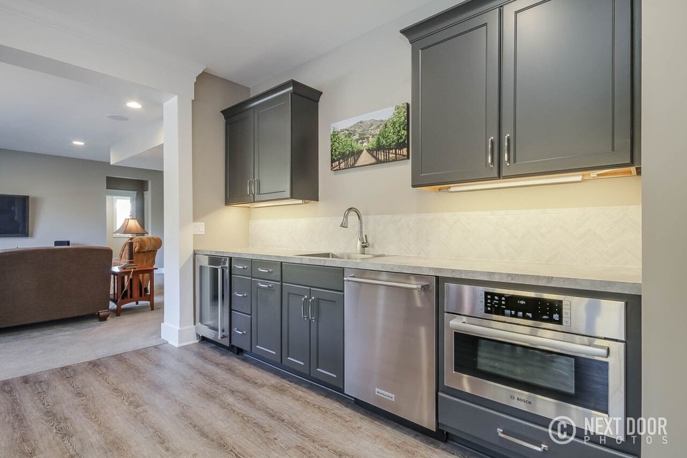 Inspiration for a small transitional walk-out basement remodel in Grand Rapids with beige walls