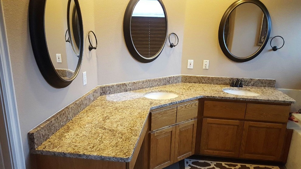 Example of a bathroom design in Seattle with granite countertops