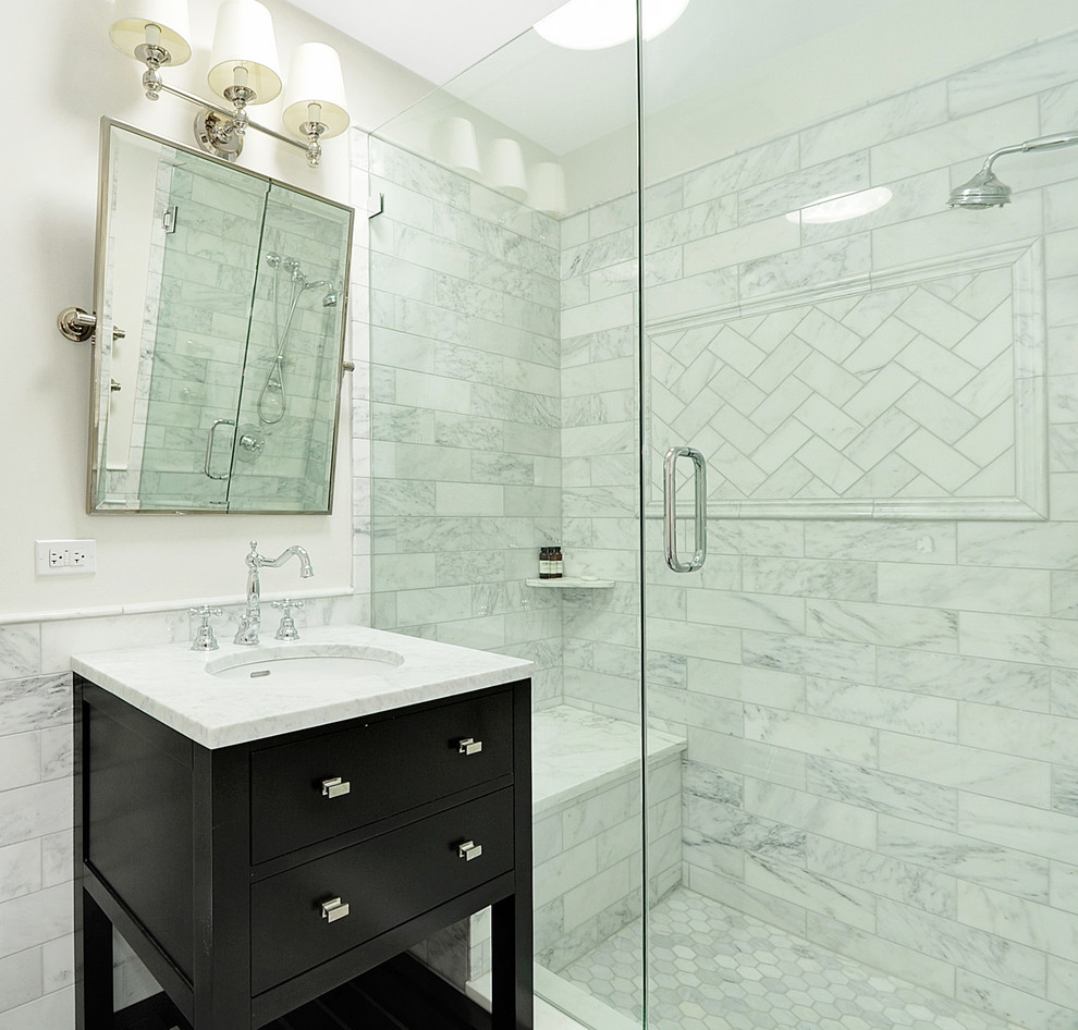 Design ideas for a large transitional master bathroom in Chicago with raised-panel cabinets, white cabinets, marble benchtops, a drop-in tub, a corner shower, white tile, stone tile, a two-piece toilet, white walls, ceramic floors, an undermount sink, white floor and a hinged shower door.