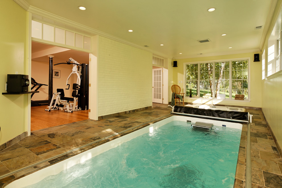 Traditional indoor rectangular pool in DC Metro with tile.