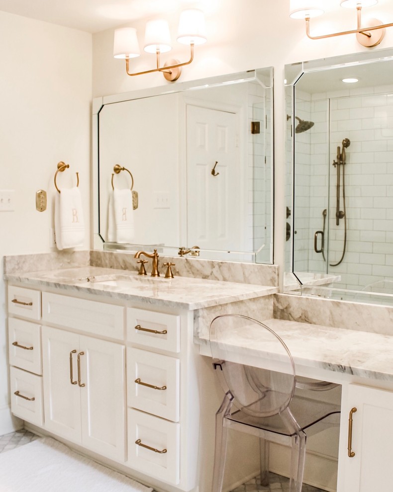 Design ideas for a mid-sized transitional master bathroom in Miami with shaker cabinets, grey cabinets, a freestanding tub, an alcove shower, a one-piece toilet, white tile, ceramic tile, white walls, marble floors, an undermount sink, marble benchtops, grey floor, a hinged shower door and grey benchtops.
