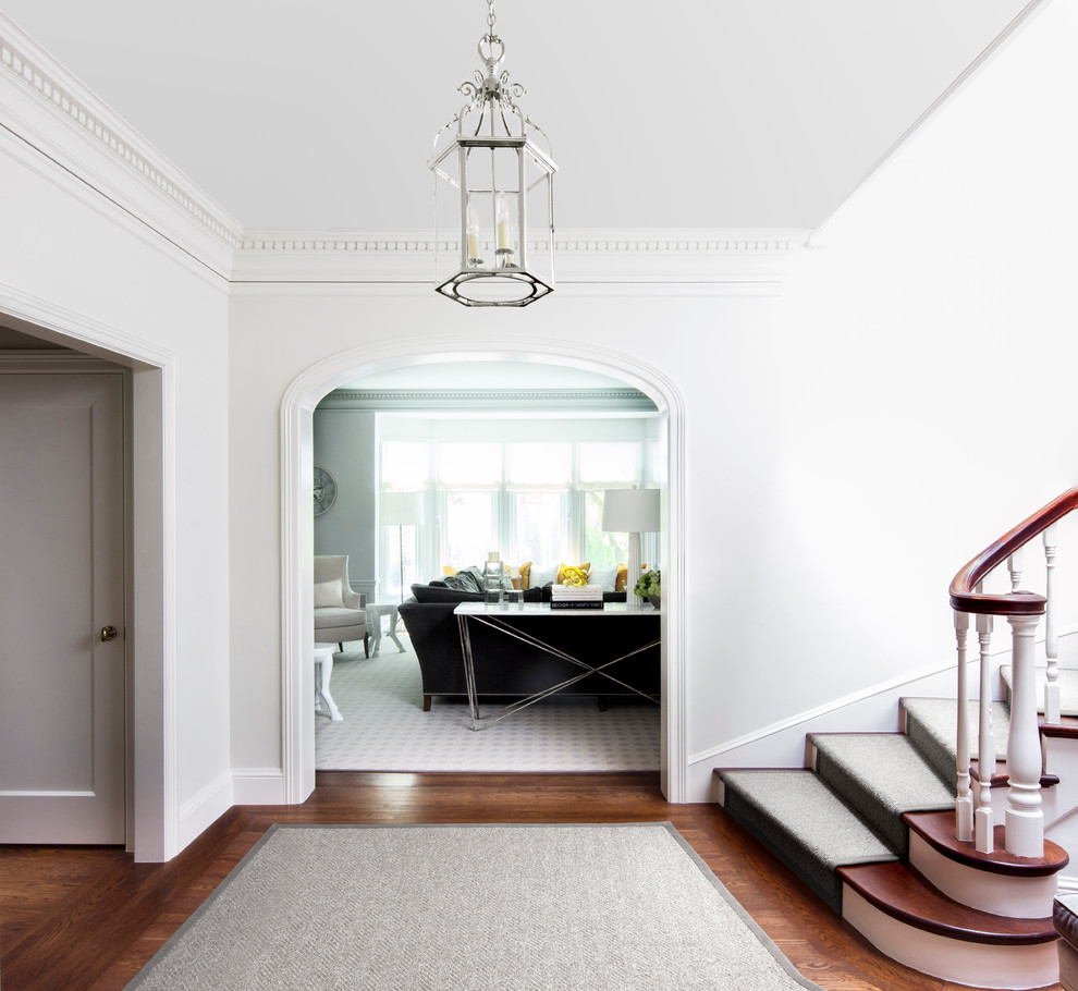 Large transitional hallway in San Francisco with white walls and medium hardwood floors.