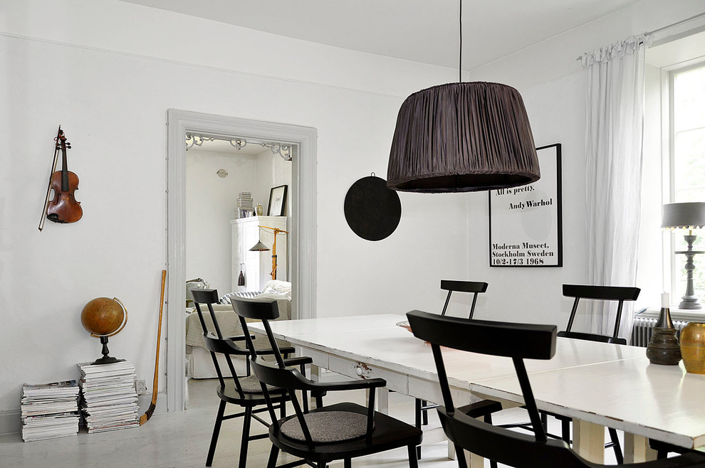 Inspiration for a mid-sized scandinavian separate dining room in Malmo with white walls and no fireplace.
