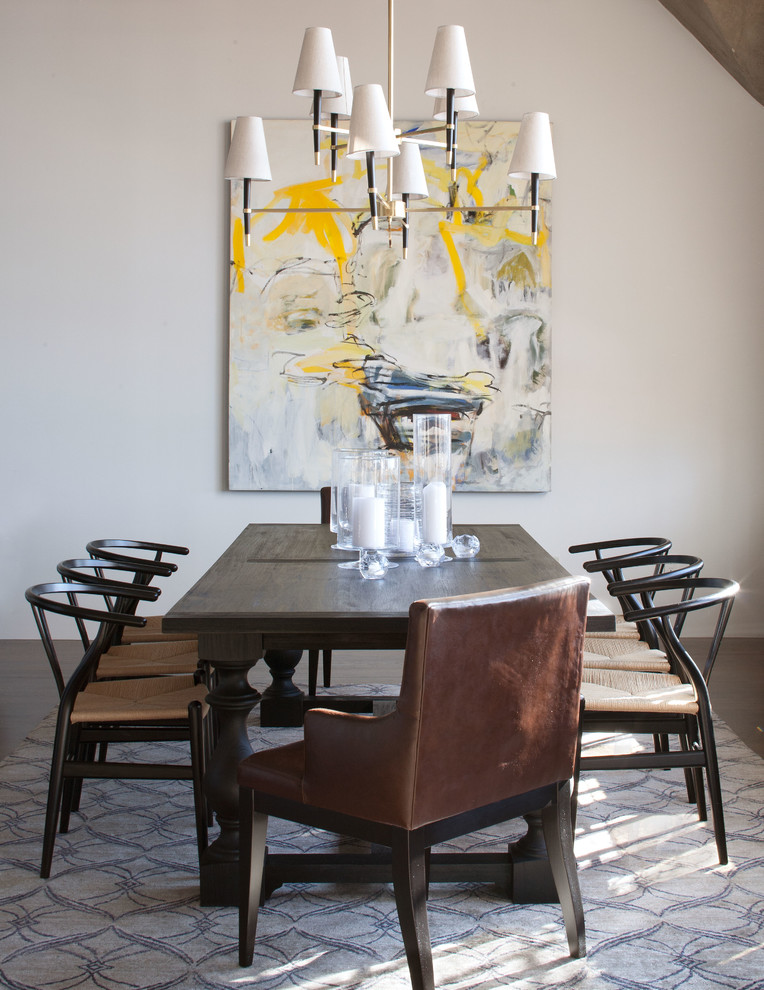 Inspiration for a transitional dining room in Denver with white walls and dark hardwood floors.