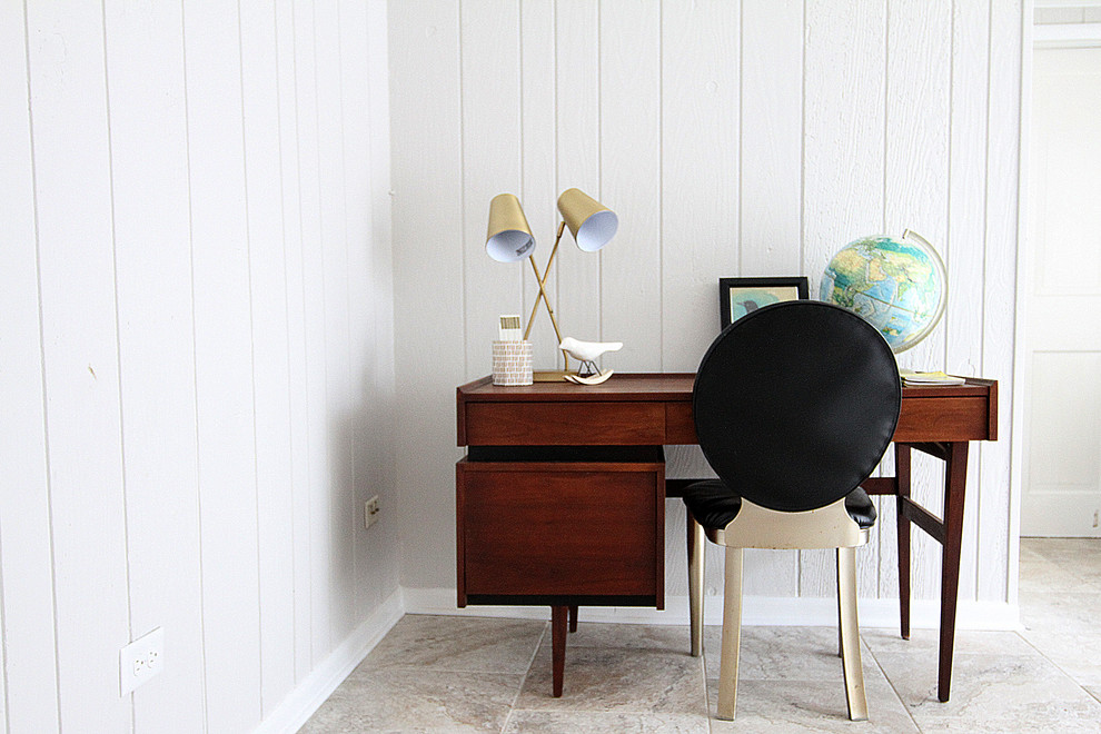 Example of a mid-sized mid-century modern basement design in Chicago with white walls