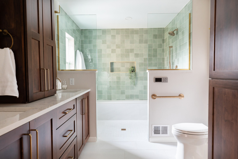 This is an example of a large modern master bathroom in Other with shaker cabinets, brown cabinets, an open shower, a one-piece toilet, green tile, ceramic tile, grey walls, ceramic floors, a drop-in sink, engineered quartz benchtops, grey floor, an open shower, white benchtops, a shower seat, a double vanity and a built-in vanity.