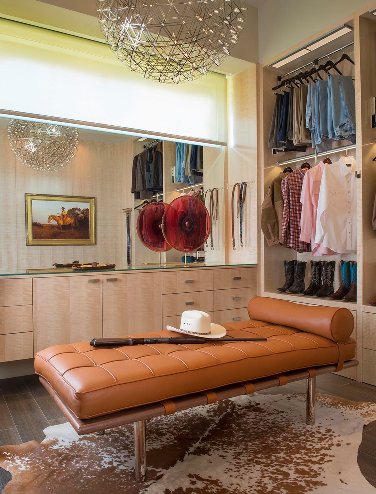 Inspiration for a mid-sized midcentury men's walk-in wardrobe in Austin with flat-panel cabinets, porcelain floors and light wood cabinets.