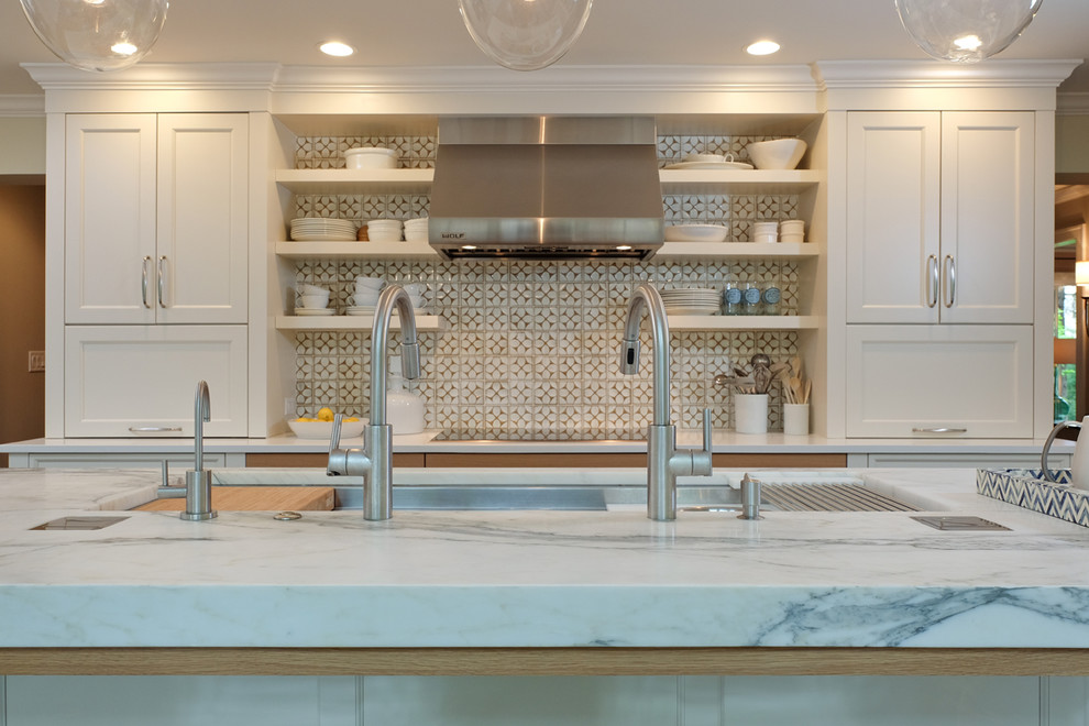 Eat-in kitchen - mid-sized transitional u-shaped medium tone wood floor eat-in kitchen idea in Chicago with white cabinets, marble countertops, an island, an undermount sink, shaker cabinets, multicolored backsplash, ceramic backsplash and paneled appliances