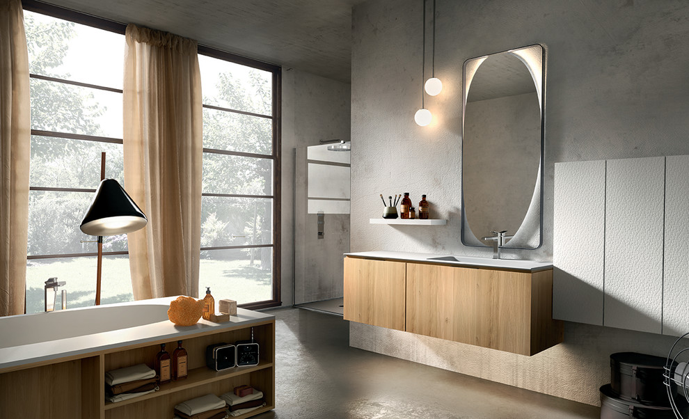 This is an example of a large modern master bathroom in New York with an integrated sink, furniture-like cabinets, light wood cabinets, solid surface benchtops, a drop-in tub, a corner shower, a one-piece toilet and concrete floors.