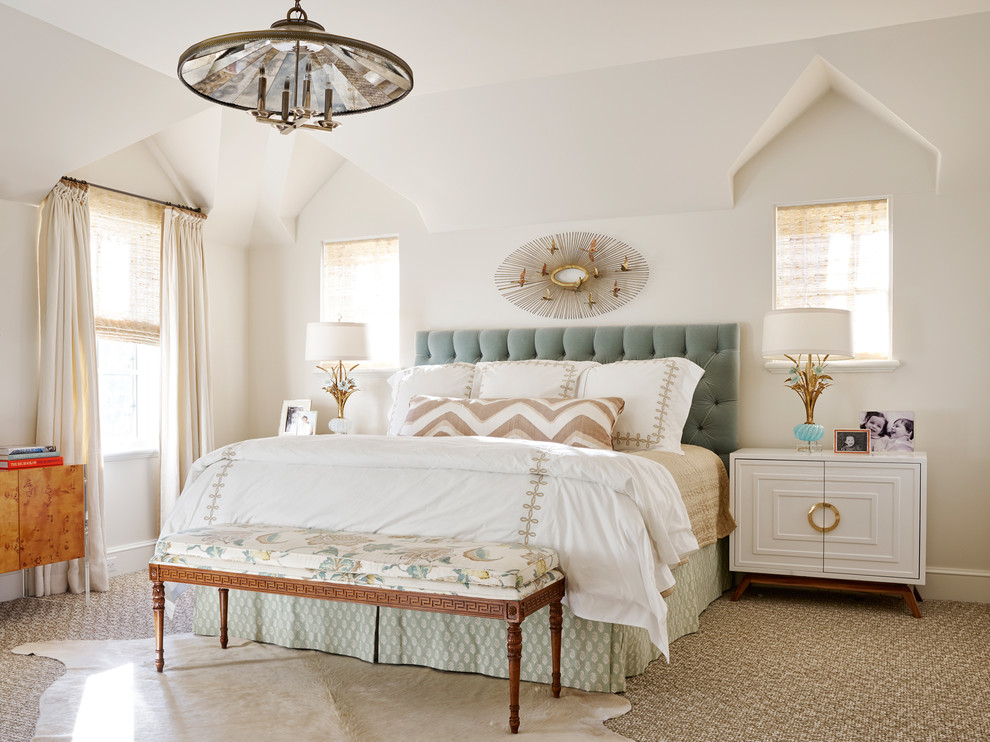 This is an example of a transitional master bedroom in Dallas with carpet and beige walls.