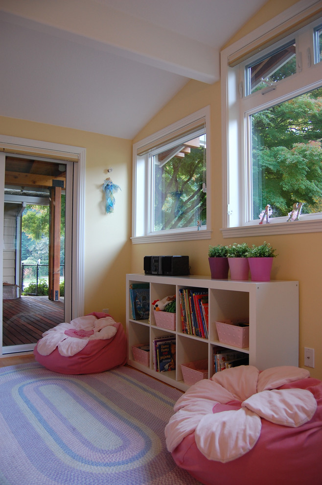 Traditional kids' playroom in Other with yellow walls for girls.