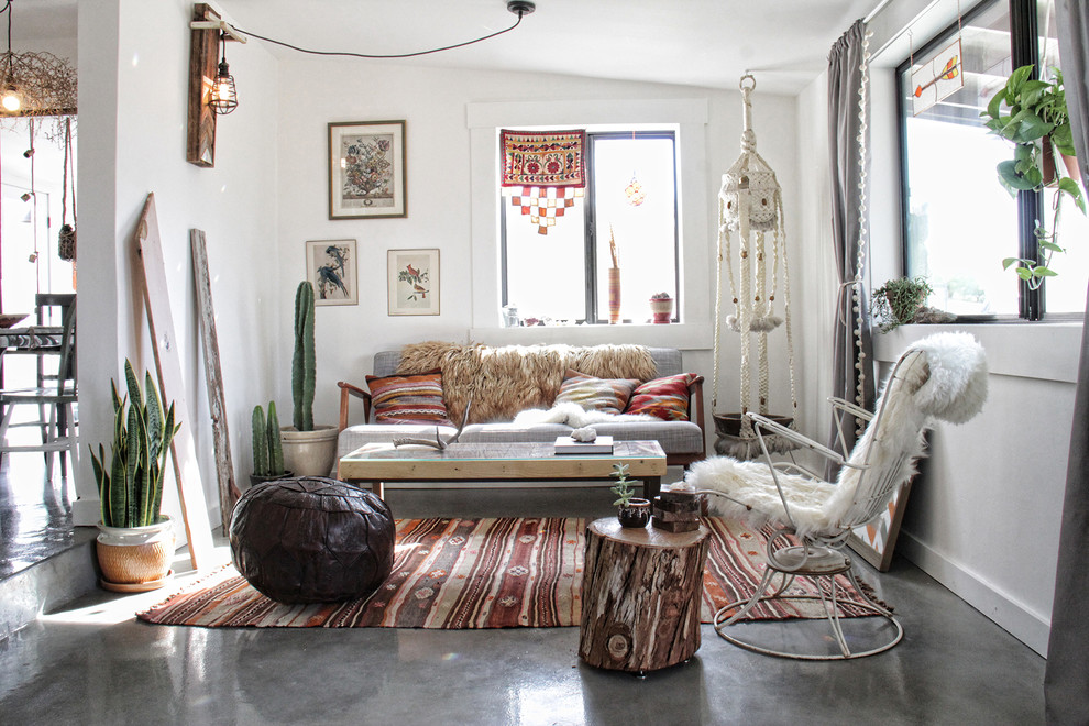 Eclectic formal and enclosed concrete floor living room photo in Los Angeles with white walls