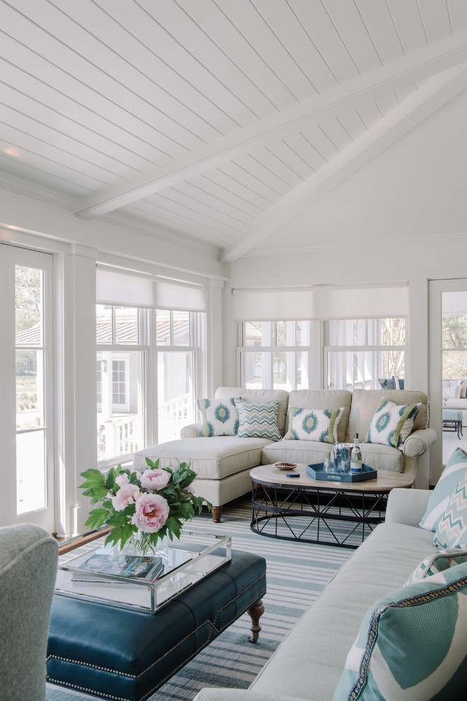 This is an example of a beach style sunroom in DC Metro.
