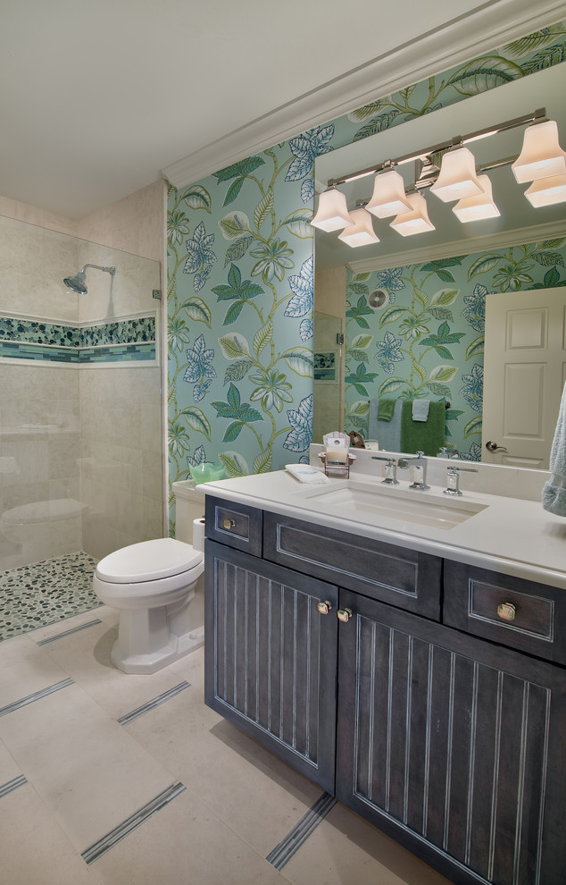 Inspiration for a small beach style kids bathroom in Miami with an undermount sink, shaker cabinets, grey cabinets, granite benchtops, a curbless shower, a two-piece toilet, beige tile, ceramic tile, green walls and ceramic floors.