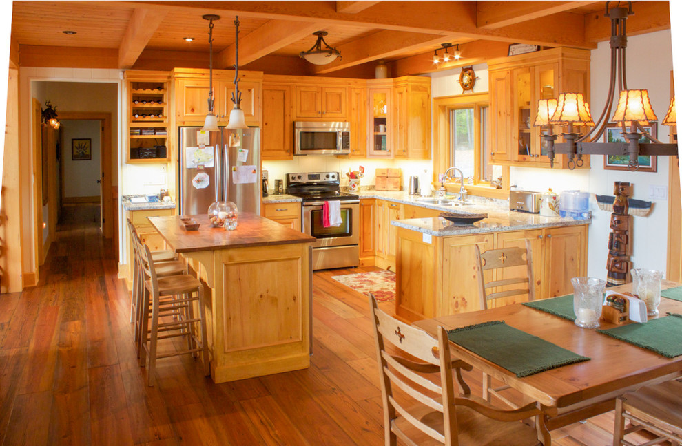 Eat-in kitchen - large rustic l-shaped medium tone wood floor eat-in kitchen idea with a double-bowl sink, beaded inset cabinets, light wood cabinets, granite countertops, stainless steel appliances and an island