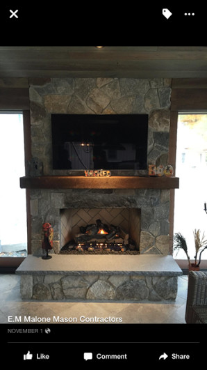 Enclosed dining room - traditional enclosed dining room idea in Bridgeport with a standard fireplace and a stone fireplace