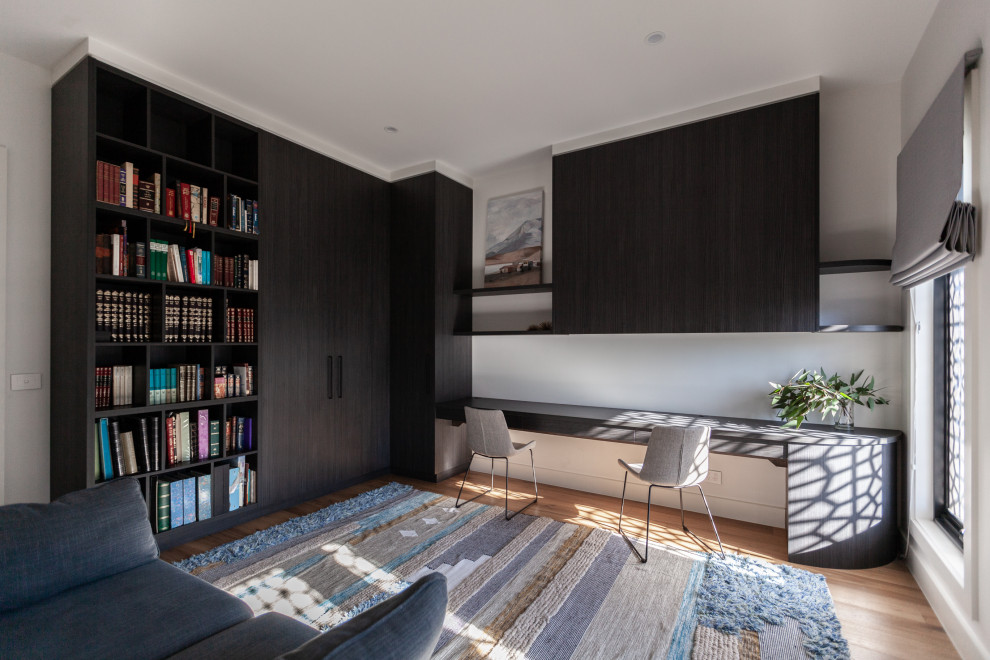 Photo of a contemporary home office in Melbourne.
